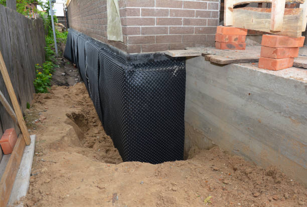 SJ Waterproofing Pros technician performing targeted Wet Basement Repair assessment in Valparaiso, IN
